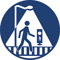 Crosswalk visibility enhancements icon showing a person crossing a street in a crosswalk under a light