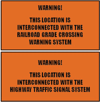 Figure 8.  Image.  Example Warning Labels.  Orange warning labels that may be affixed inside the main door of the highway traffic signal cabinet controller (top) and the railroad grade crossing equipment bungalow (bottom) to alert highway agency and railroad personnel of the interconnection between the two systems.