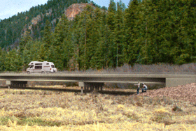 An image of the bridge digitally added to the valley image with the bridge concrete in gray.