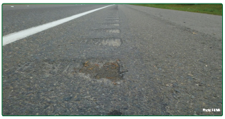 "Rumble strips with shallower depth on the left and greater depth on the right."