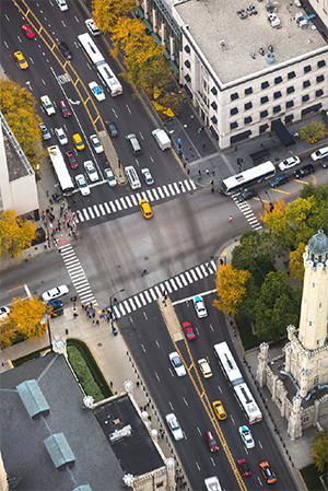 "aerial view of intersection on a four way street"