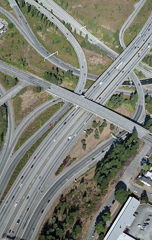 "aerial photo of intersecting highways and interchanges"