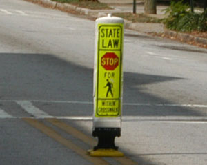 "Photo.  A pedestrian knock-down sign."
