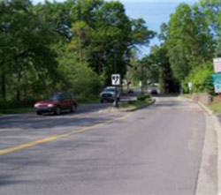 "Photo. A gateway treatement or a landscaped island entering a rural community. "