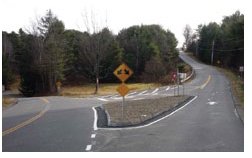 "Photo of a channelizing island at a Y-shaped intersection."