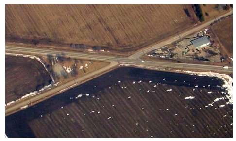 Aerial photograph of an intersection that is shaped mor like an 'x' than a 't.'""