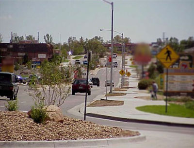 Photo of South Golden Road after numerous improvements featuring roundabouts and other safety measures where the design supports speed compliance even with a 25 mph speed limit in addition to enhancing access, operations, and safety for all users.