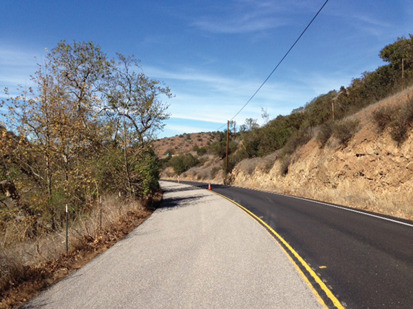 Figure 60. A picture of a horizontal curve to the left on which the approach lane has been treated with a high-friction surface treatment.