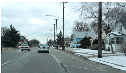 A buffered bicycle lane in a suburban area.
