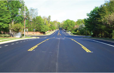 In this application, a 3-lane configuration transitions to a 2-lane configuration by eliminating the two-way left-turn lane immediately after the final left turn.