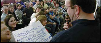 Photo: Man speaking to a crowd