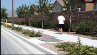 Photo: Pedestrian walking on paved walkway