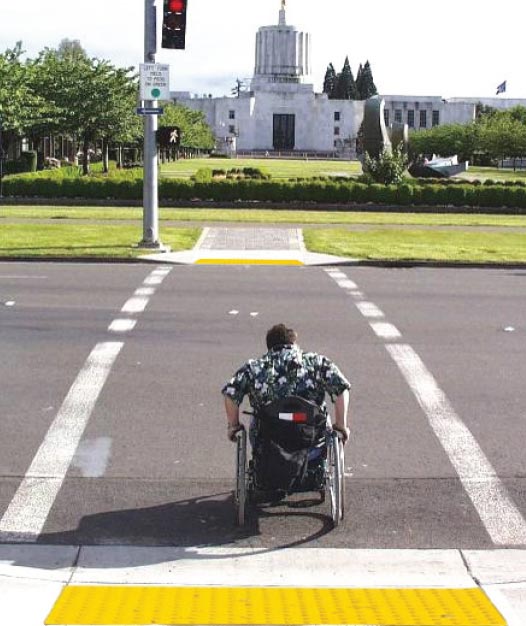 An LPI allows a pedestrian to establish a presence in the crosswalk before vehicles are given a green indication. Source: FHWA