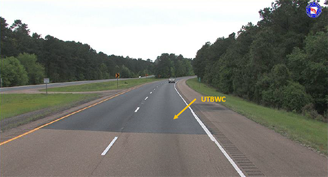 "photograph of a section of Interstate 30 Westbound that has been overlaid with UTBWC"