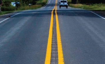 "A rural two-lane roadway treated with a center line rumble strip."