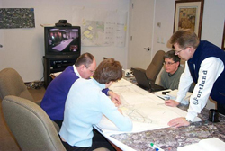 Road safety audit team reviewing roadway plans