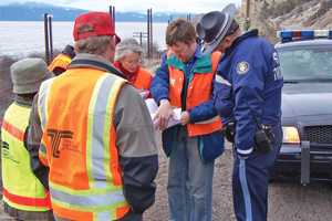 Photo of a Road Safety Audit team inspecting construction drawings.