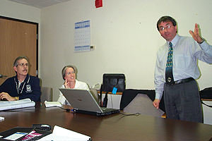 Photo showing a Road Safety Audit team at a table in a boardroom.