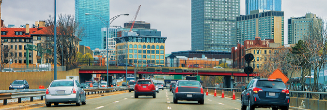 photo from the cover of the Road Safety Fundamentals report showing cars on the Massachusetts Turnpike, eastbound, in the vicinity of Massachusetts Avenue