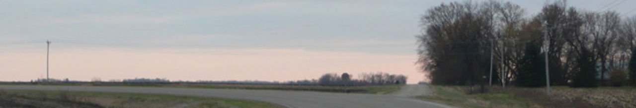 photo of a tangent extension of a minor road adjacent to the horizontal curvature of a major road