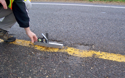 Photo (two of two) of Agency staff inspecting pavement.