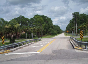 Page v photo. This image shows a section of roadway crossing a culvert.