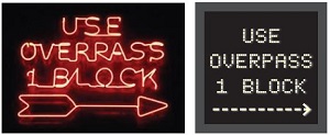 "two signs (neon and DMS) that each read: Use Overpass | 1 Block"