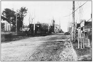 View of a city street, macadamized as an object-lesson road during the State good roads convention in Raleigh, NC.