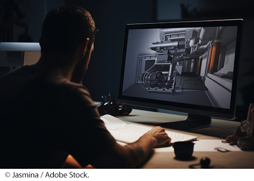 An engineer working on a blueprint in a digital design program on the computer. The work is performed in a home office and viewed on a large desktop screen. Image Source: © Jasmina / Adobe Stock.