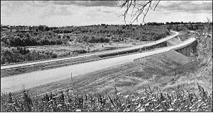 View of America's most scenic highway of 1961 at the point where it makes a wide sweeping curve around the Mayflower Hill campus of Colby College in Waterville, ME.