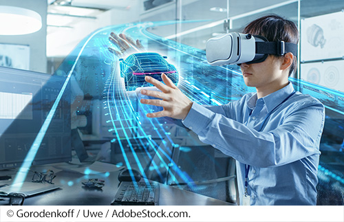 A young man wearing virtual reality goggles reaches out to manipulate a 3-dimensional computer representation of a car driving on a road. Image source: © Gorodenkoff / Uwe / AdobeStock.com.