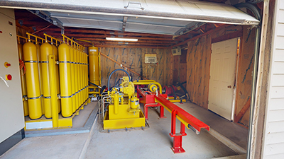 The interior room of a garage containing a propulsion system. 