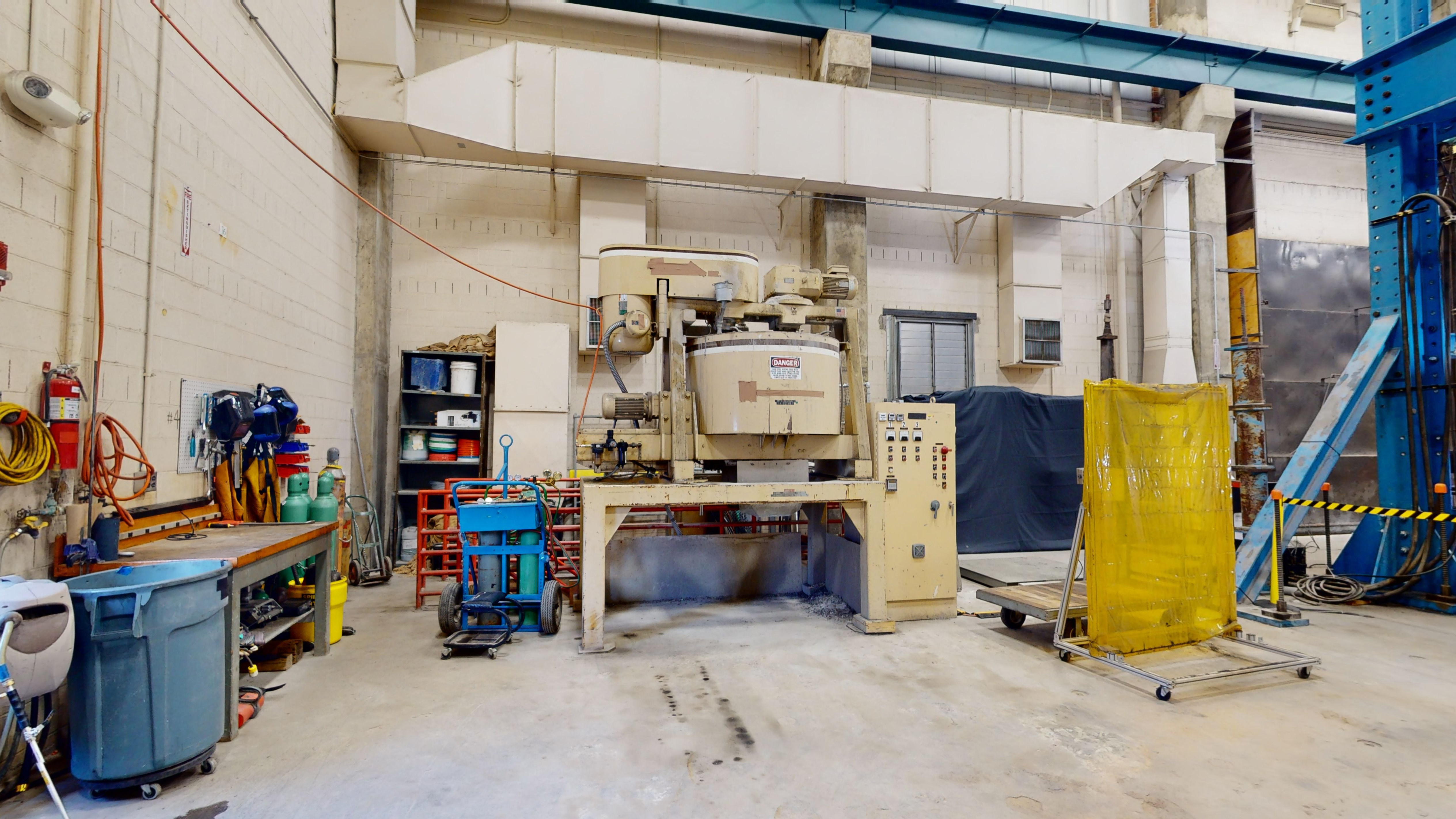 Part of a laboratory space where a concrete mixing station is located.  