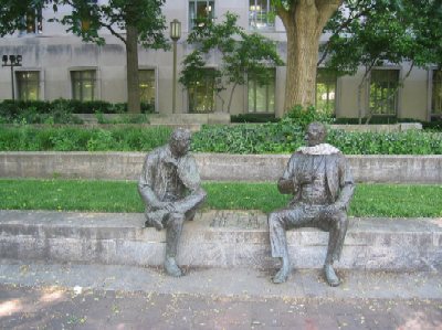 This statue of two men playing chess sits along a walk in Marshall Park, named after John Marshall, who served as Chief Justice of the U.S. Supreme Court from 1801 to 1835. An unknown passerby placed a scarf around the neck of the man on the right.